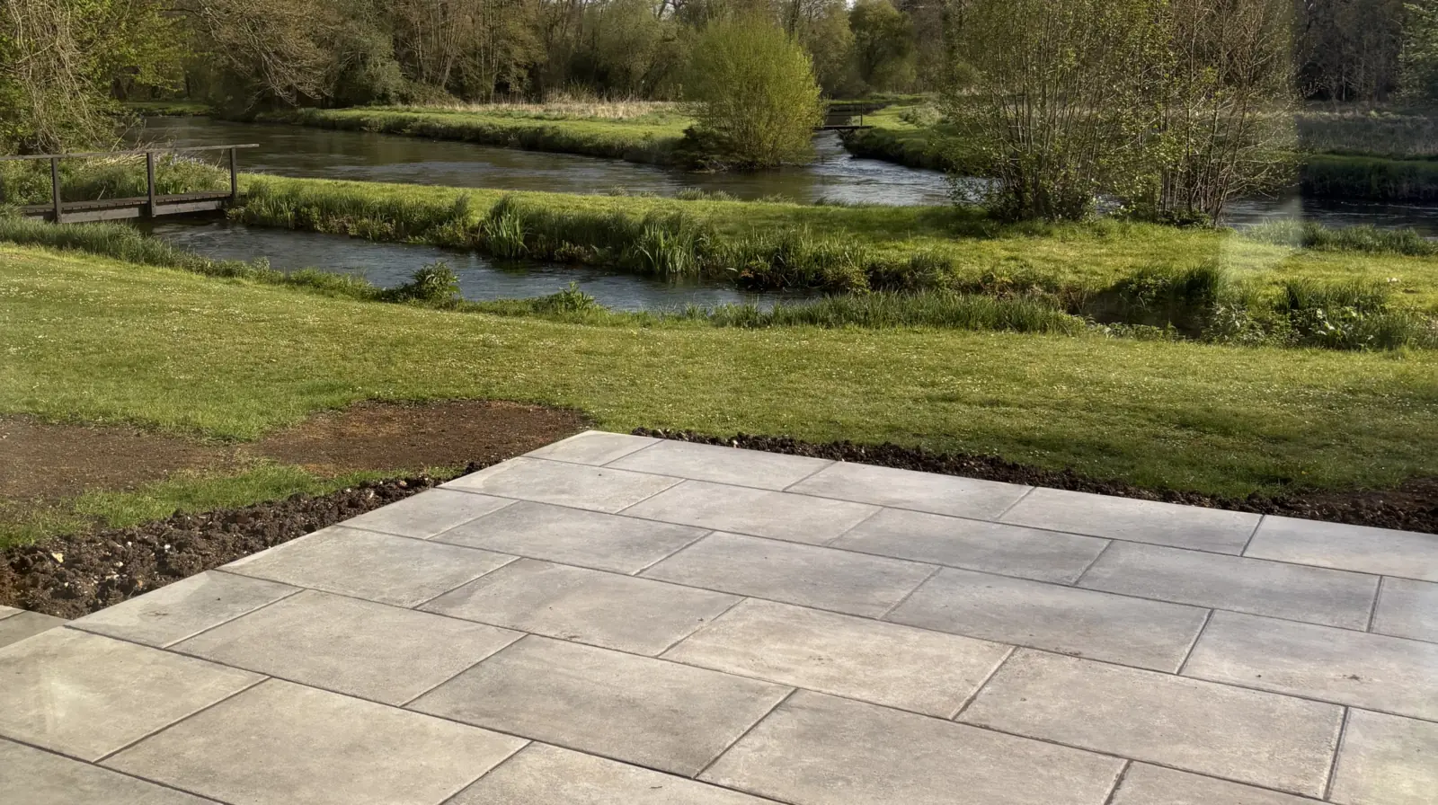 The new stone terrace, looking out over the River Test